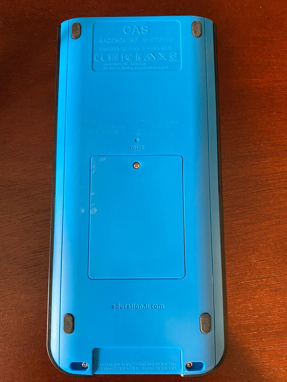 Texas Instruments Graphing Calculator with Blue Accents and Black Body - Picture 5 of 8
